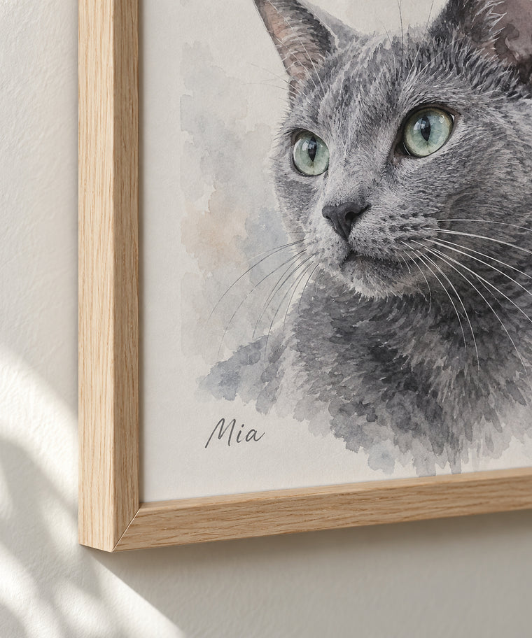 Close-up of the cat portrait in a wooden frame with the name Mia